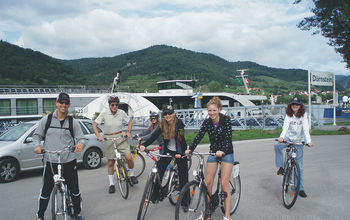 Family cycling on a shore excursion in Durnstein