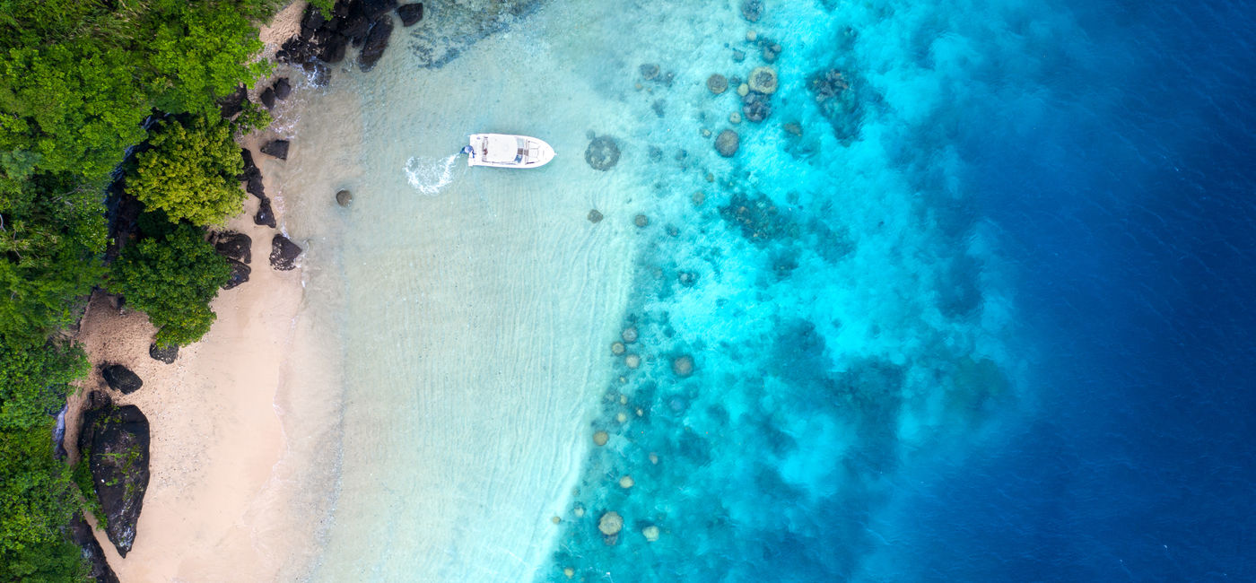 Image: Boat and beach (Photo via Tourism Fiji)