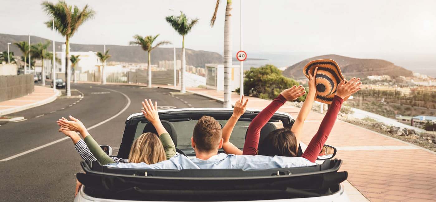 Image: Group of young people going on a road trip. (Photo Credit: Adobe Stock/Alessandro Biascioli)
