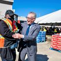 Delta Air Lines CEO Ed Bastian greets a ground worker.