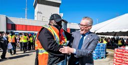 Delta Air Lines CEO Ed Bastian greets a ground worker.