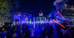 Guests brandish their lightsabers at the 'Disneyland After Dark: Star Wars Nite' event.