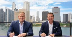 Jason Liberty, Chairman and CEO of Royal Caribbean Group, and Adam Stewart, Executive Chairman of Sandals Resorts, sign mega deal,
