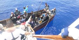 Carnival Paradise crew members saving stranded sailors. 