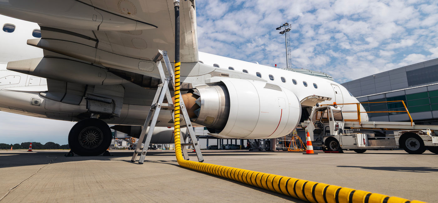 Image: Plane being refueled before a flight. (Photo Credit: Chalabala / Adobe Stock)