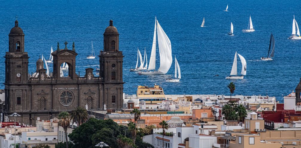 The Cathedral of Santa Ana in the historic Vegueta quarter, with sailing boats off the coast of Las Palmas