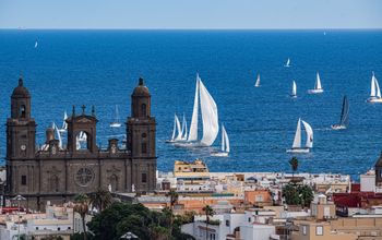 The Cathedral of Santa Ana in the historic Vegueta quarter, with sailing boats off the coast of Las Palmas
