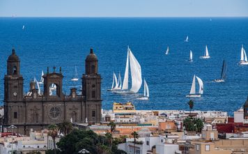 The Cathedral of Santa Ana in the historic Vegueta quarter, with sailing boats off the coast of Las Palmas