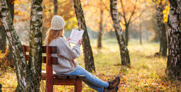 Book woman forest bench