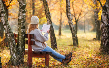 Book woman forest bench