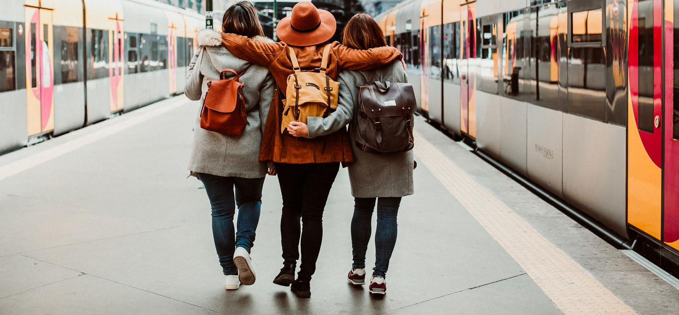 Image: Travelers taking the train in Porto, Portugal. (Photo Credit: lubero / Adobe Stock)