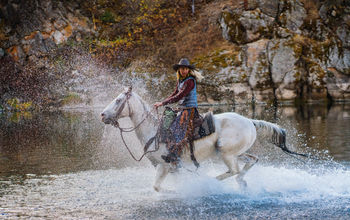 Horseback riding at The Resort at Paws Up, Greenough, Montana.