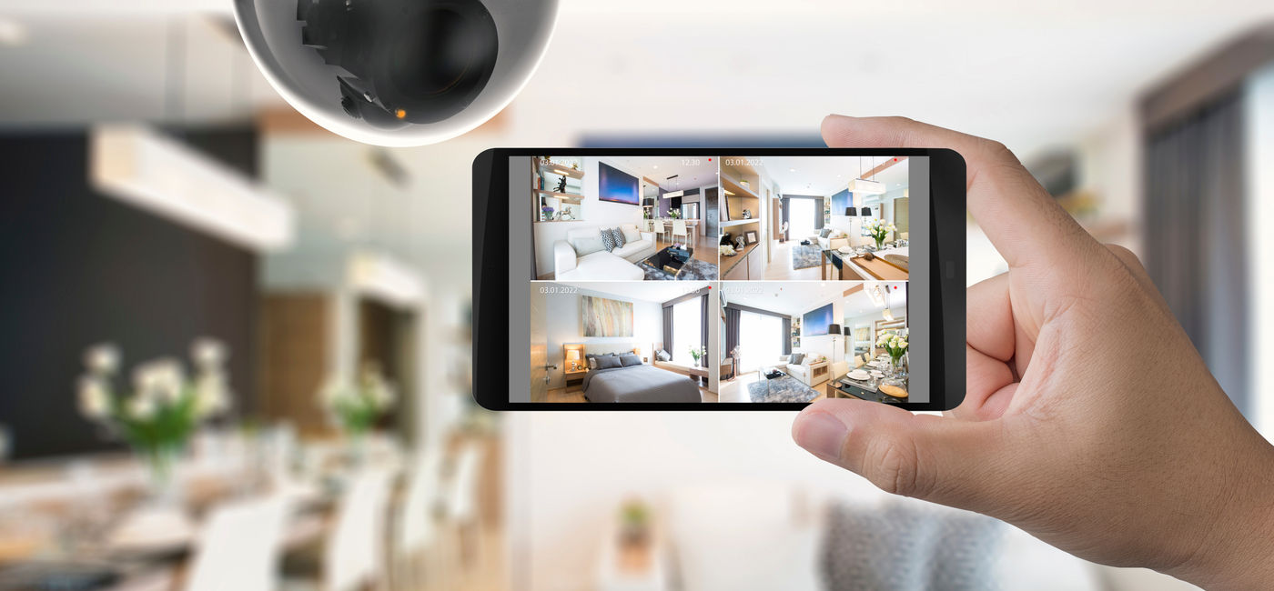Image: Security camera monitoring a home. (Photo Credit: phonlamaiphoto/Adobe)