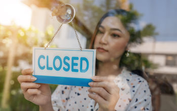 Woman closing her business.