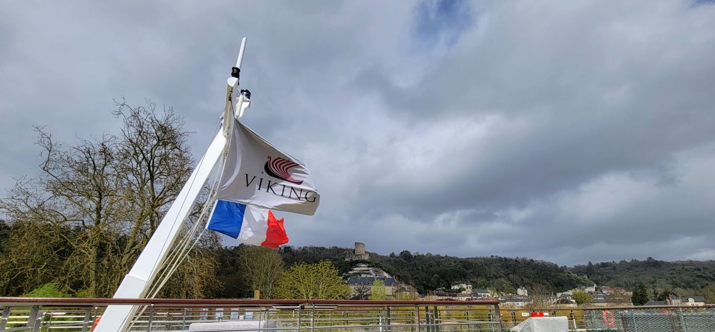 Image: The Viking Radgrid's flag waves on the upper deck while docked in La Roche-Guyon, a small town along the River Seine. (Photo Credit: Lacey Pfalz)