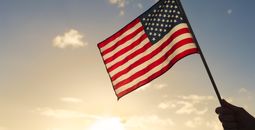 A person holding the American flag