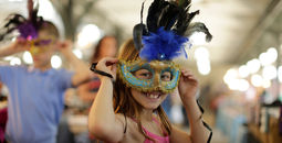 Masked girl at parade.