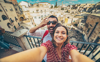 Tourists posing for a selfie in the south of Italy