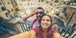 Tourists posing for a selfie in the south of Italy