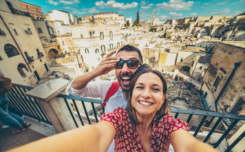 Tourists posing for a selfie in the south of Italy