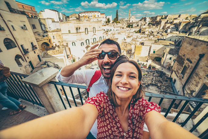 Tourists posing for a selfie in the south of Italy