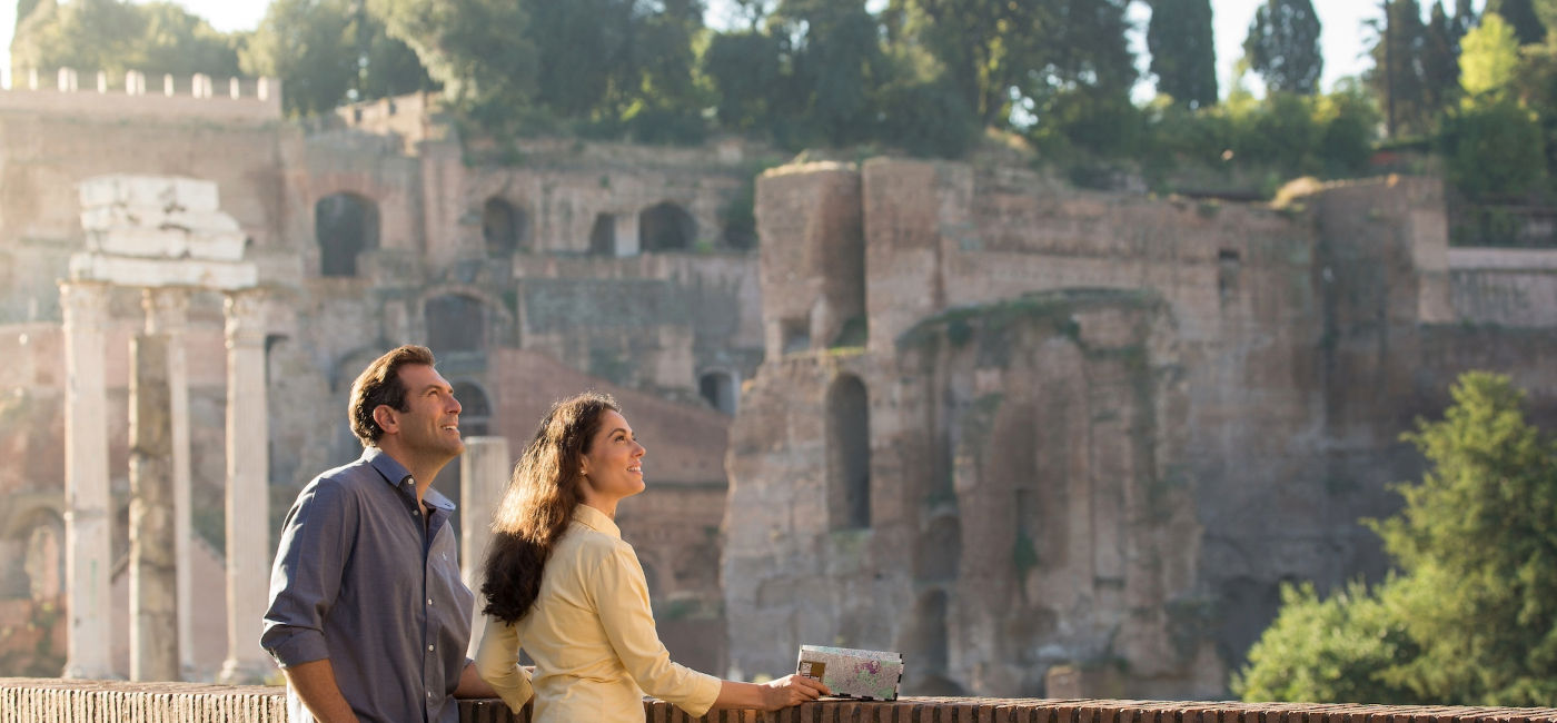 Image: A couple wanders through ruins in Rome, Italy. (Photo Credit: Globus)
