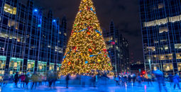 People ice skating around a Christmas tree in Pittsburgh