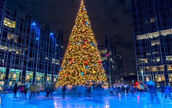 People ice skating around a Christmas tree in Pittsburgh