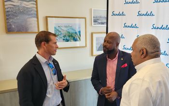 Adam Stewart (left) with Carlos James, minister of tourism for Saint Vincent and the Grenadines (center) and Gary Sadler, Unique Vacations' executive vice president of sales and industry relations
