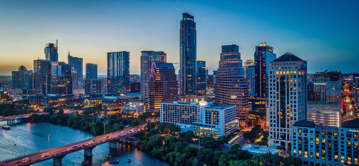 Image: Austin, Texas skyline at sunset. (Photo Credit: Ryan Conine/Adobe)