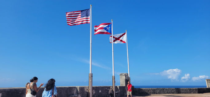 The American, Puerto Rican and Burgundian flags fly above Castillo San Cristobal in Old San Juan, Puerto Rico. American flag, puerto rico flag, puerto rican flag, castillo san cristobal, burgundy flag, flag of burgundy, old san juan, viejo san juan, puerto rico, flags