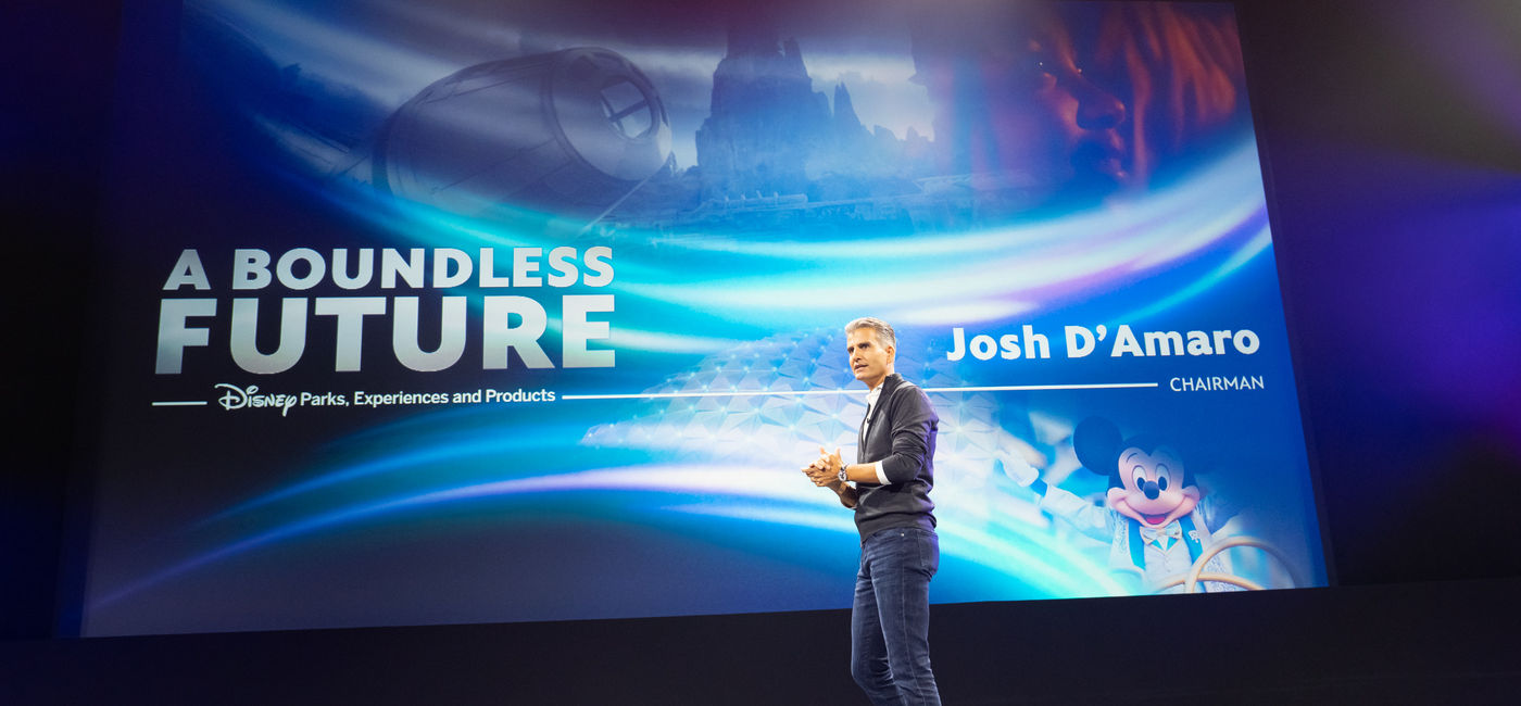 Image: Josh D’Amaro, Disney Parks, Experiences and Products Chairman, at D23 2022 (Photo via Disney)