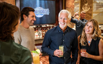 Princess Cruises guests enjoying a drink at the Good Spirits At Sea bar.