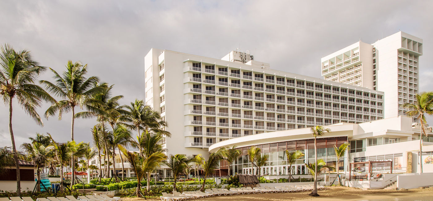 Image: Caribe Hilton exterior. (Photo Credit: Caribe Hilton Media)
