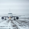 Airliner on runway in blizzard, snow, ice, plane,