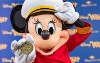 A commemorative coin created for the Disney Wish features Captain Minnie.