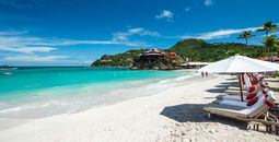 French island in a Caribbean sea (photo via daniloforcellini / iStock / Getty Images Plus)
