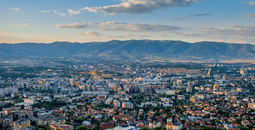 Top view from Vodno mountain on Skopje city in Macedonia on sunset (photo via RossHelen / iStock / Getty Images Plus)