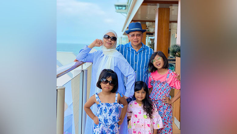 Noormah Bte Salim, an avid cruiser, enjoying her seacation on board World Dream with her husband and three granddaughters.