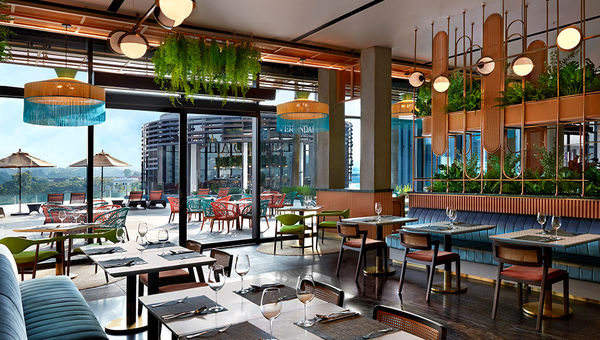 Verandah Rooftop Rotisserie serves modern European cuisine in a lush urban oasis setting.