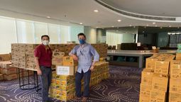 MAH CEO Yap Lip Seng (right) handling the aid cartons with MAH Selangor chapter secretariat Francis Alberto.