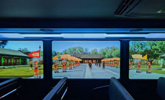 Transparent screens overlay digital scenes onto the live view of Yuanmingyuan Park.