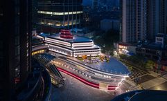 The Louis is a chrome, ship-shaped cultural landmark in Shanghai featuring exhibitions, a café, and luxury retail across three storeys.