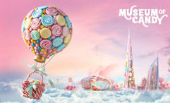 The museum features over 15 themed rooms with interactive exhibits, including a Gummy Bear Pool, Cotton Candy Bath, unique candy stations, and a creative Sugar Rush Room.
