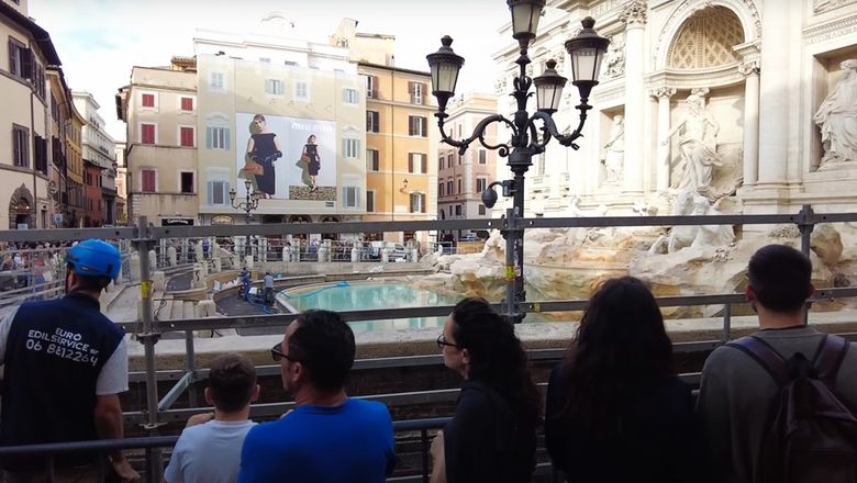 As construction for the walkway is planned, the Trevi Fountain is currently being barricaded to for a two-month clean up.