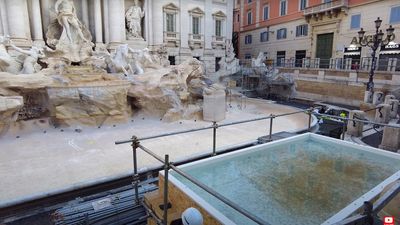 The wooden tub allows tourists to toss coins while the Trevi Fountain is closed for maintenance, maintaining the tradition despite the iconic attraction being unavailable.
