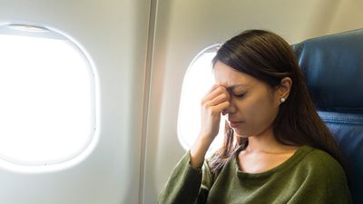 The argument began when a passenger refused to raise her reclined seat, blocking another passenger's view, leading to verbal harassment and disruptive behaviour from the couple.