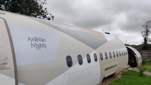 Camping in a converted ex-Etihad plane. Image courtesy of Apple Camping.