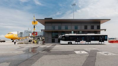 This facility streamlines remote flight boarding by providing sheltered access between buses and  aircraft via aerobridges.