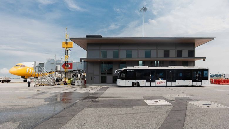 This facility streamlines remote flight boarding by providing sheltered access between buses and  aircraft via aerobridges.